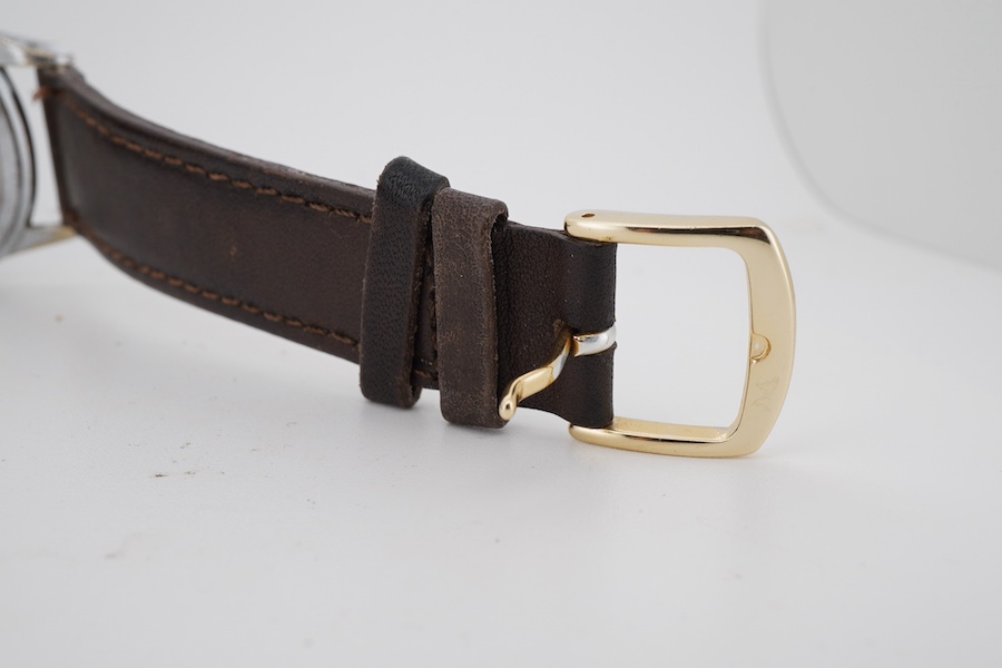 A gentleman's 1950's stainless steel Timor manual wind wrist watch, with Arabic and baton numerals dial and subsidiary seconds, on a later associated strap, case diameter 34mm, case back with engraved personal inscriptio